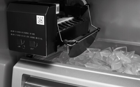 Wire arm on ice box in freezer